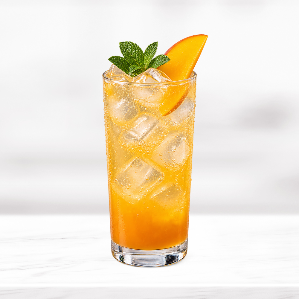 Refreshing mango soda with ice, fresh mango and mint garnish