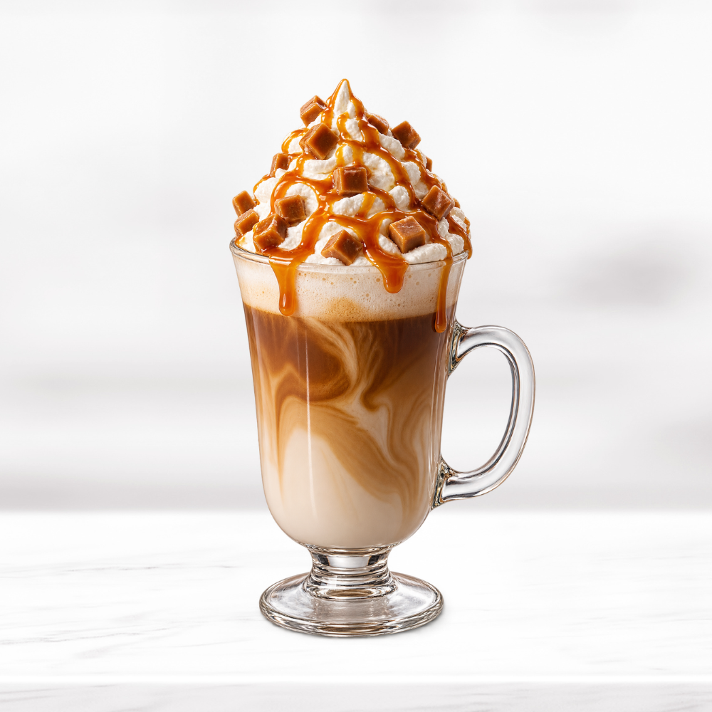 Salted caramel latte topped with whipped cream, caramel drizzle and caramel pieces